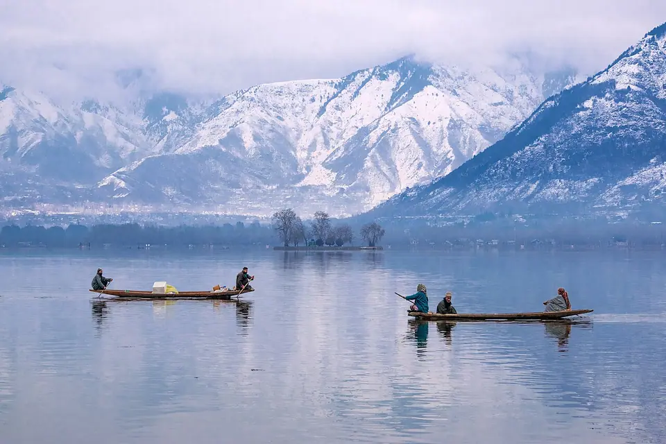 Shikara boats on Dal Lake with the Hazratbal shrine in Srinagar, Kashmir