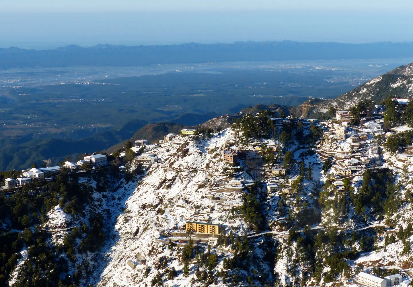 Snow over the Mussoorie hills above the Dehradun valley